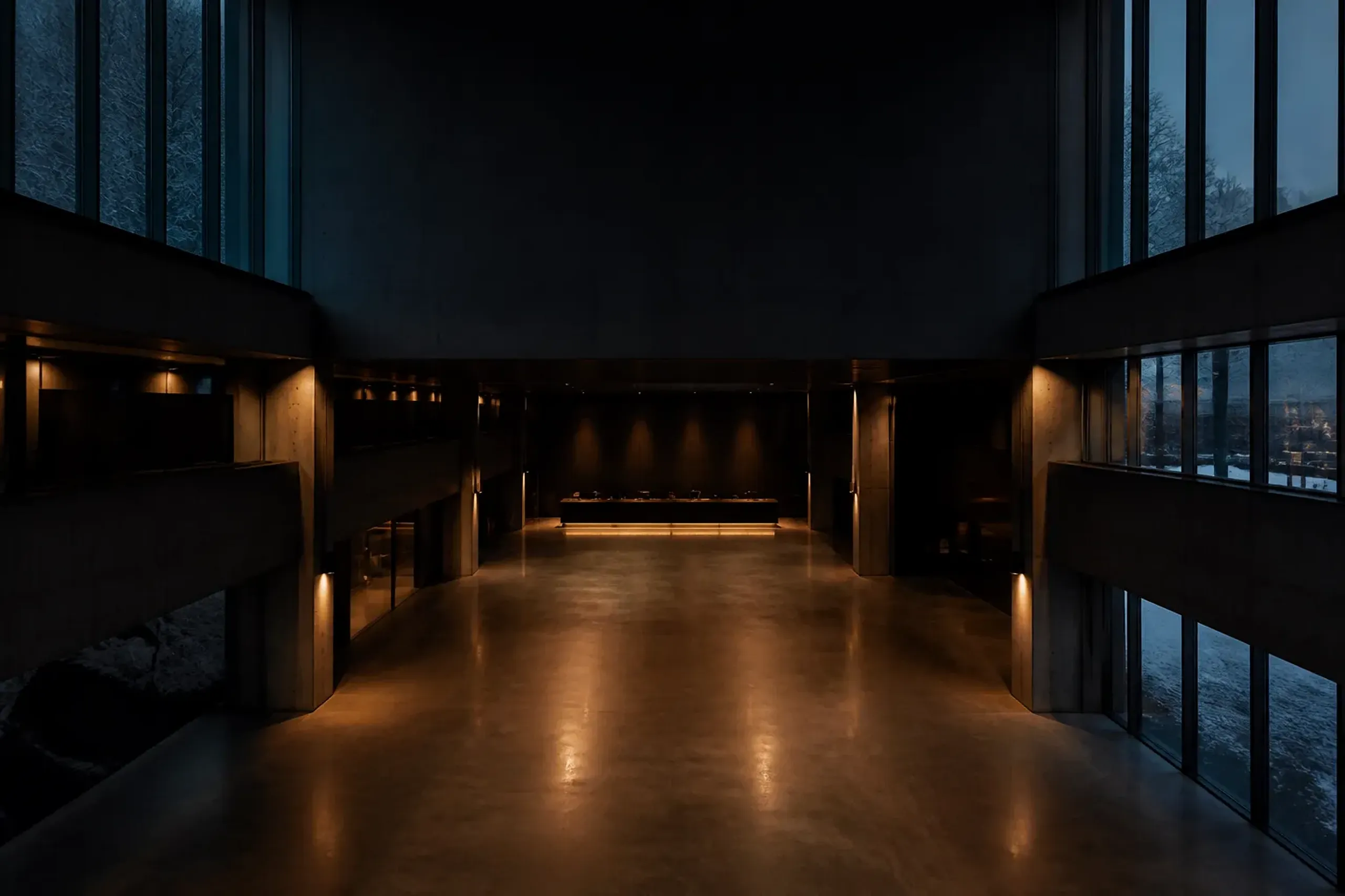 Empty modern Japanese museum atrium at closing time with dimmed lights