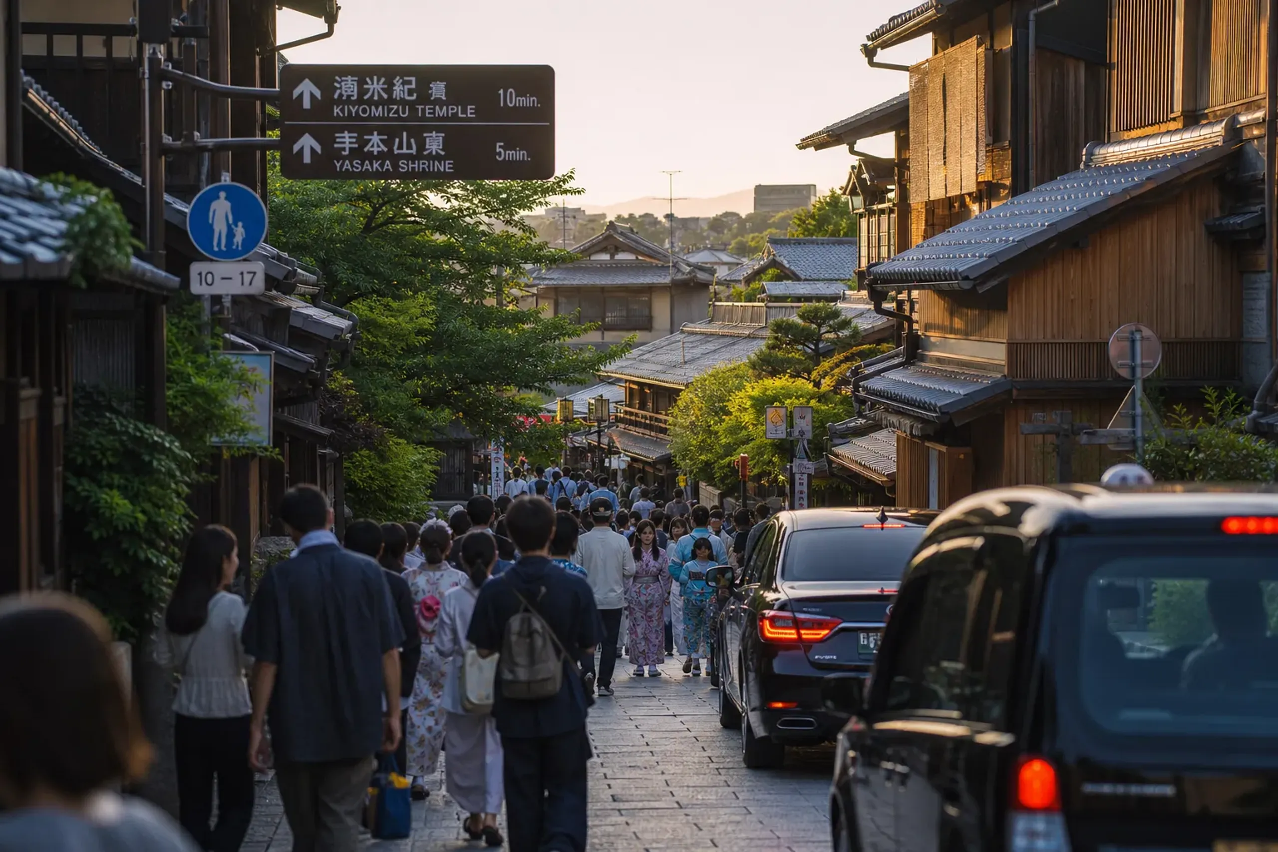 Crowded Kyoto street with slow-moving traffic near popular sightseeing district