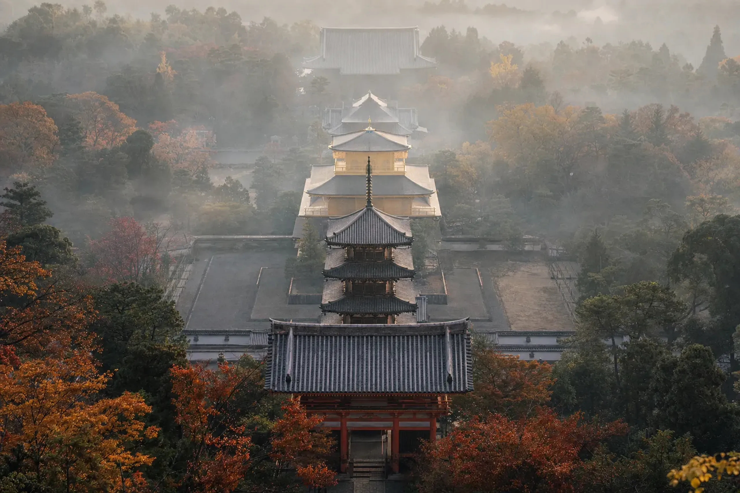 The strict single-line 'Shitennō-ji style' arrangement of south gate, pagoda, and lecture hall reproduced in 6th-to-7th-century Asuka form at Shitennō-ji