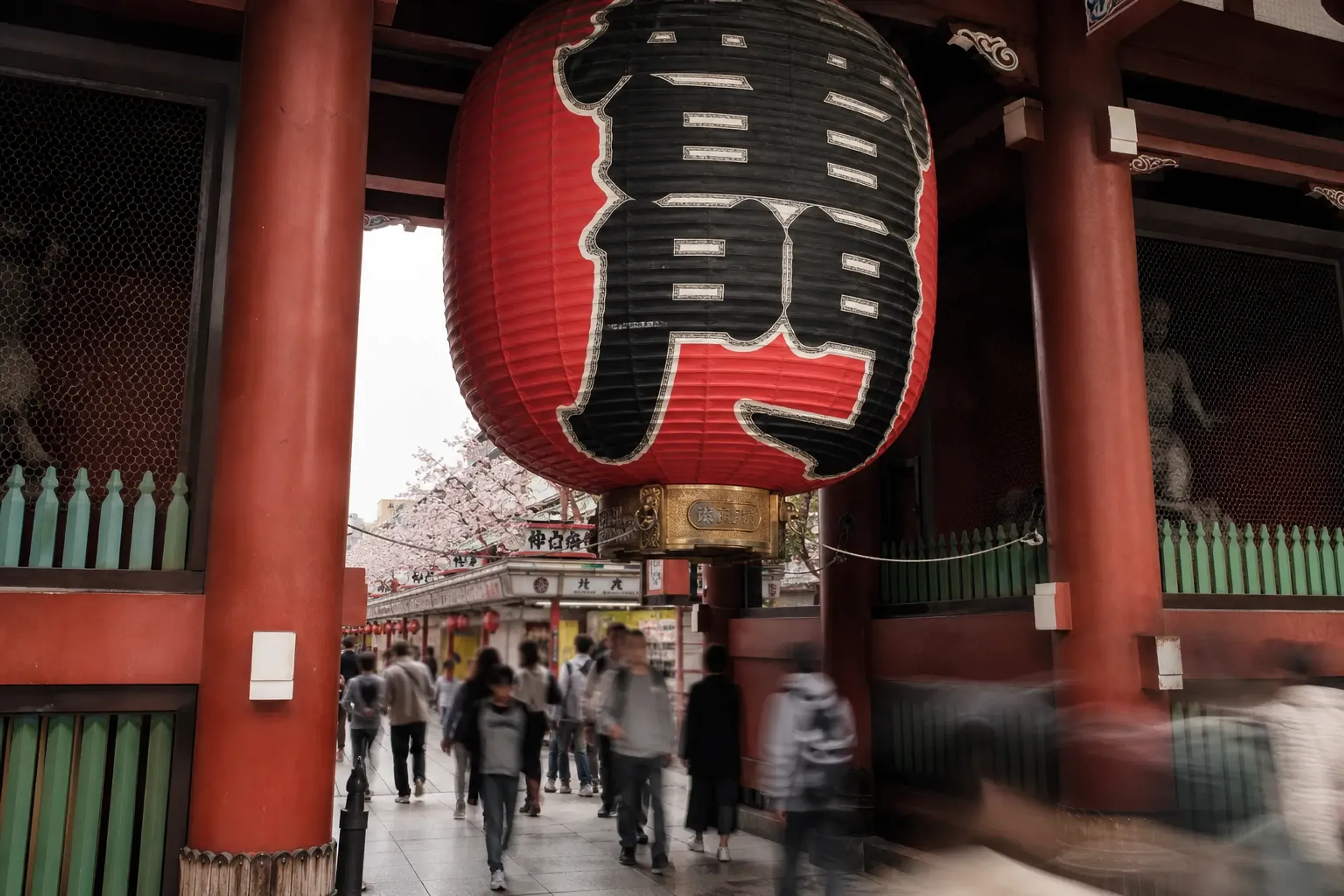 Kaminarimon gate at Sensō-ji in Asakusa, Tokyo during daytime with visitors walking