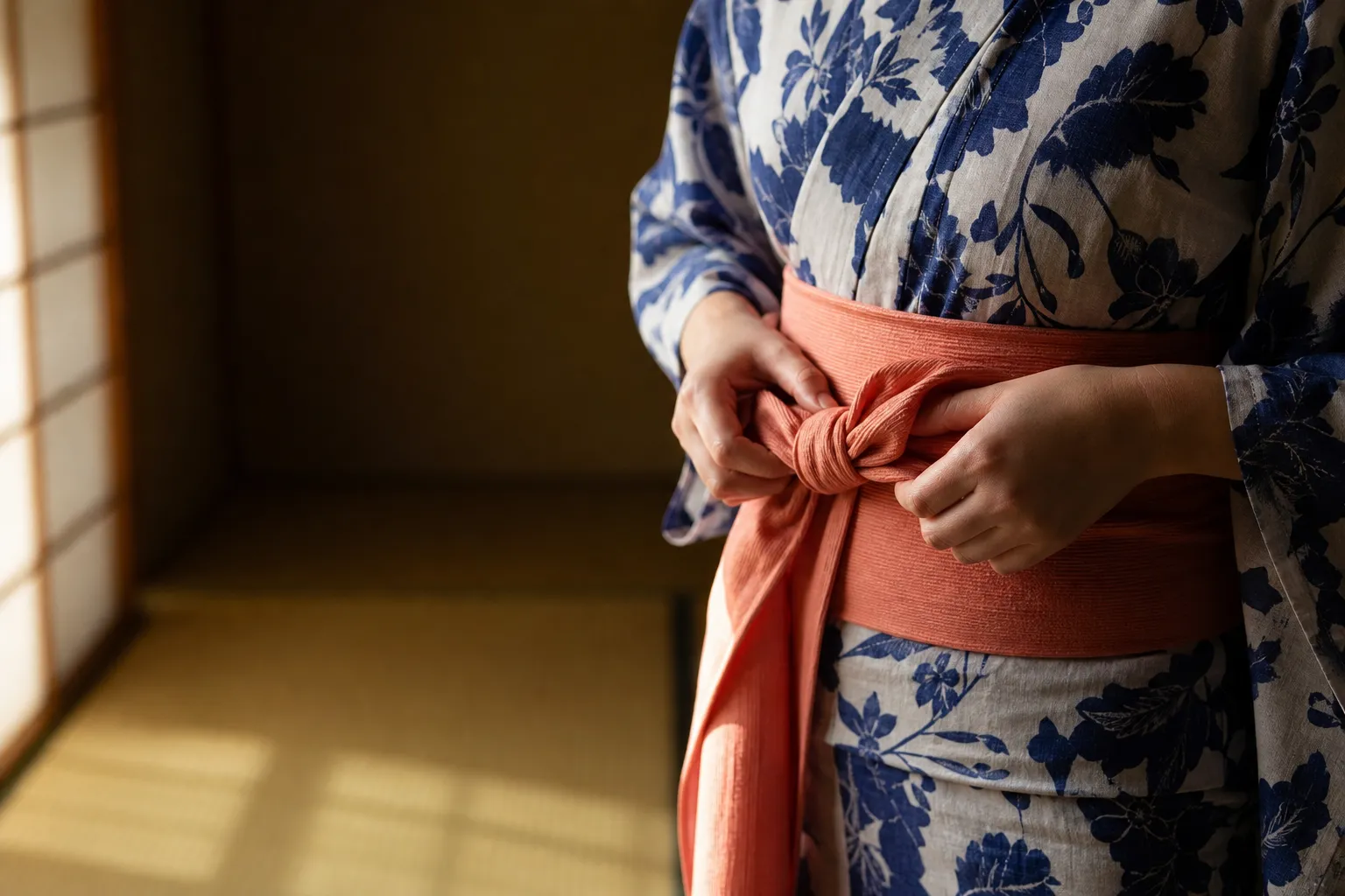 A person wearing a traditional summer yukata at a Japanese festival