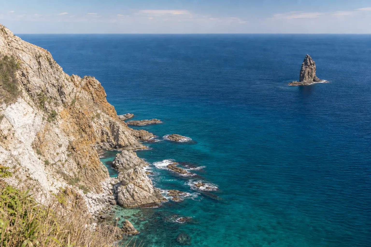 The cobalt blue coastline and cliffs of the Shakotan Peninsula in Hokkaido in summer