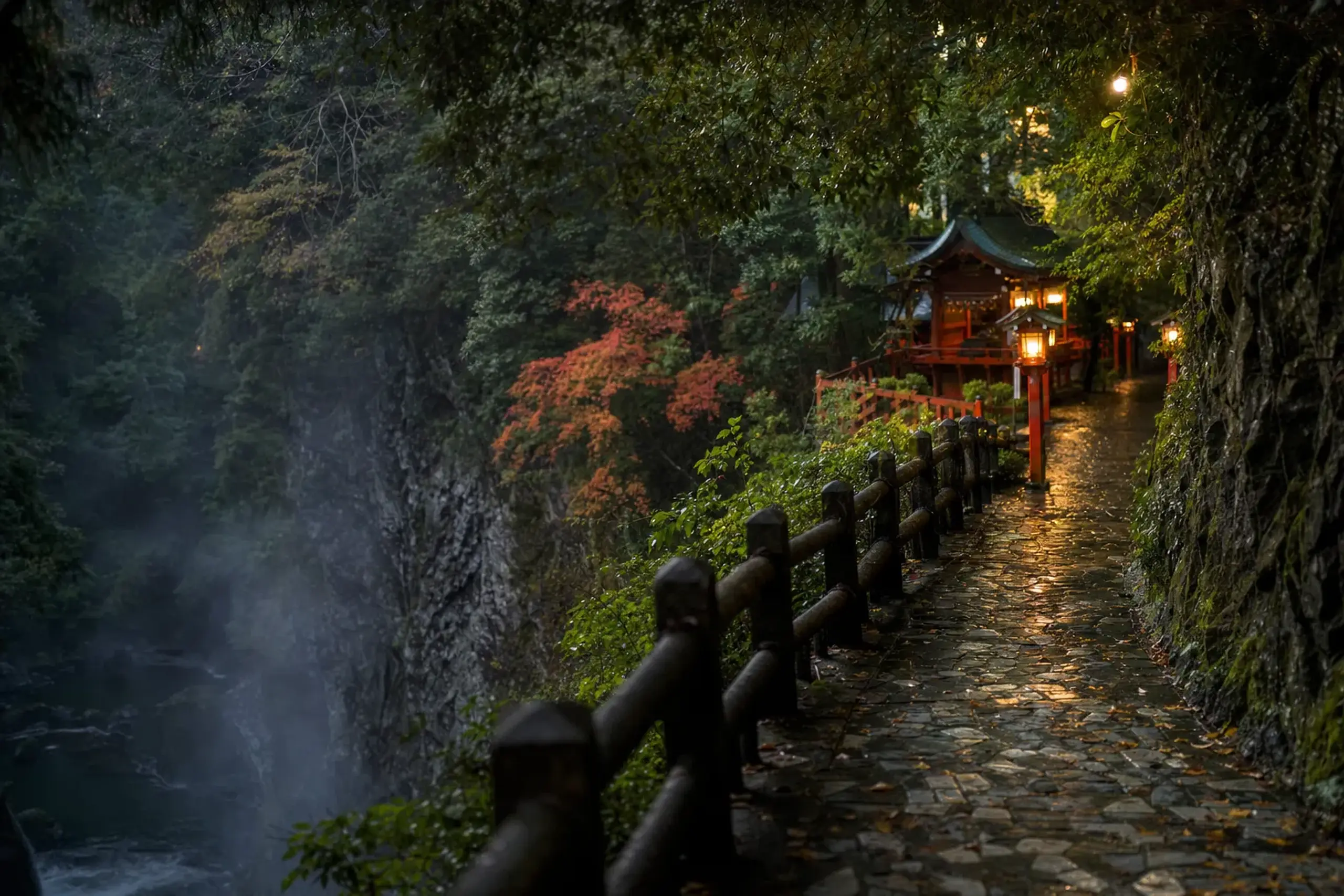 the paved 1-kilometer clifftop walking path along Takachiho Gorge leading toward the vermilion buildings of Takachiho Shrine