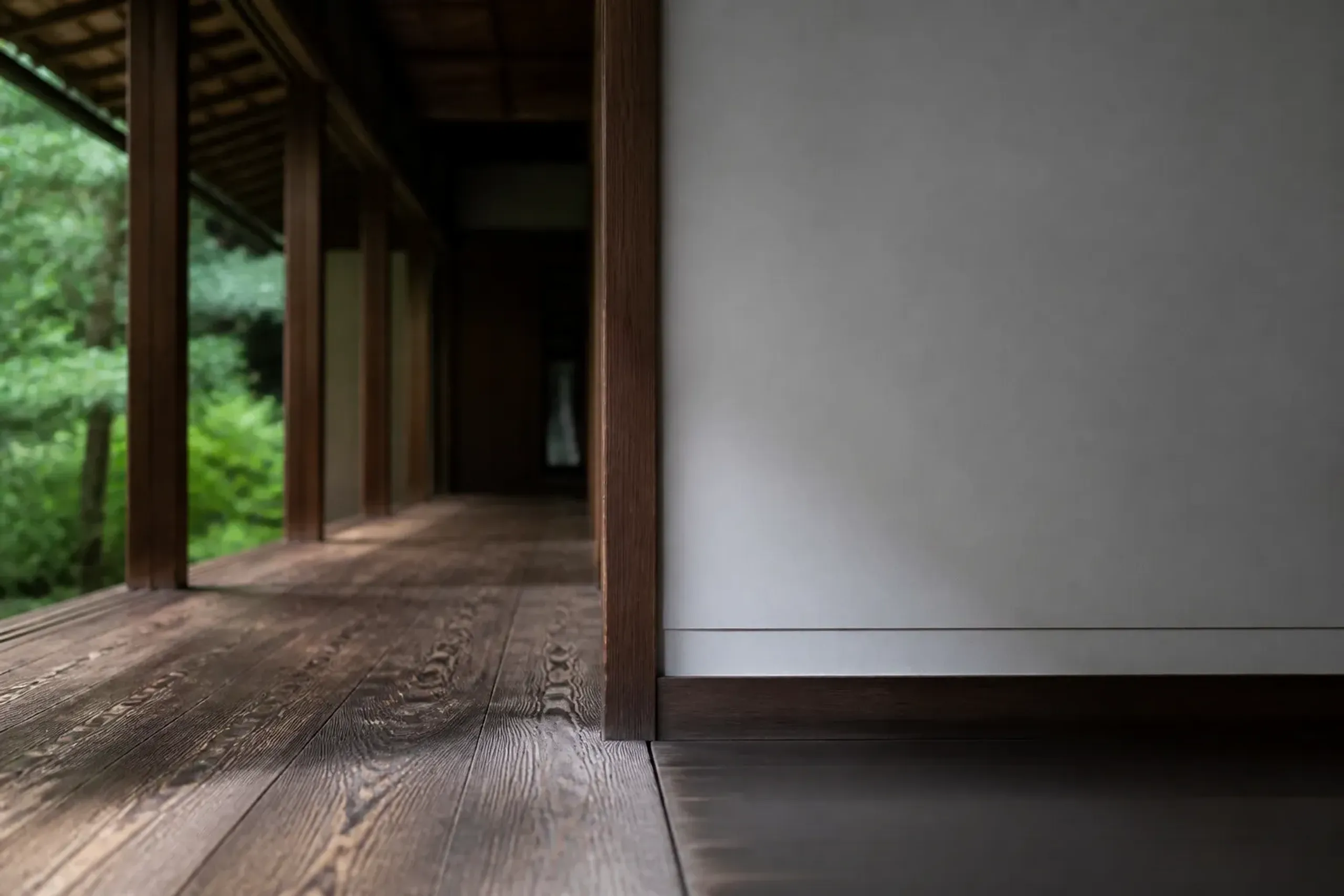 Architectural detail showing traditional wood and modernist design elements in a Kyoto ryokan