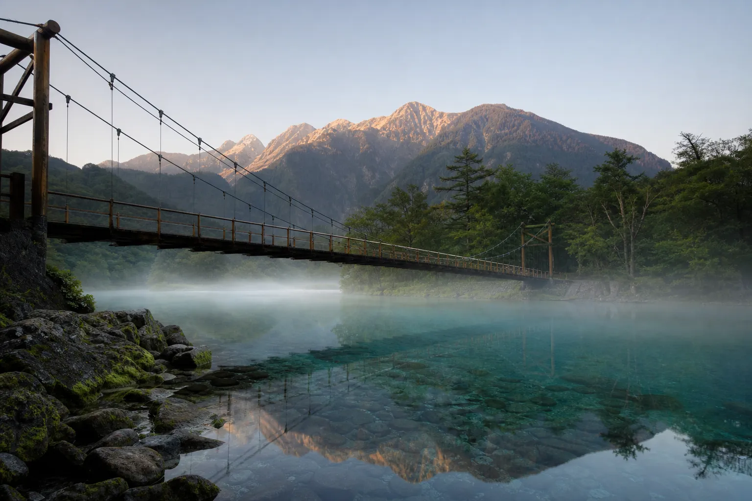 Kappabashi (Kappa Bridge) in Kamikochi at dawn with the Azusa River and mountains behind