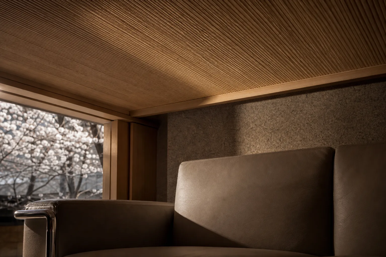 Detail of brushed wood ceiling and Italian furniture in the Bvlgari Suite.