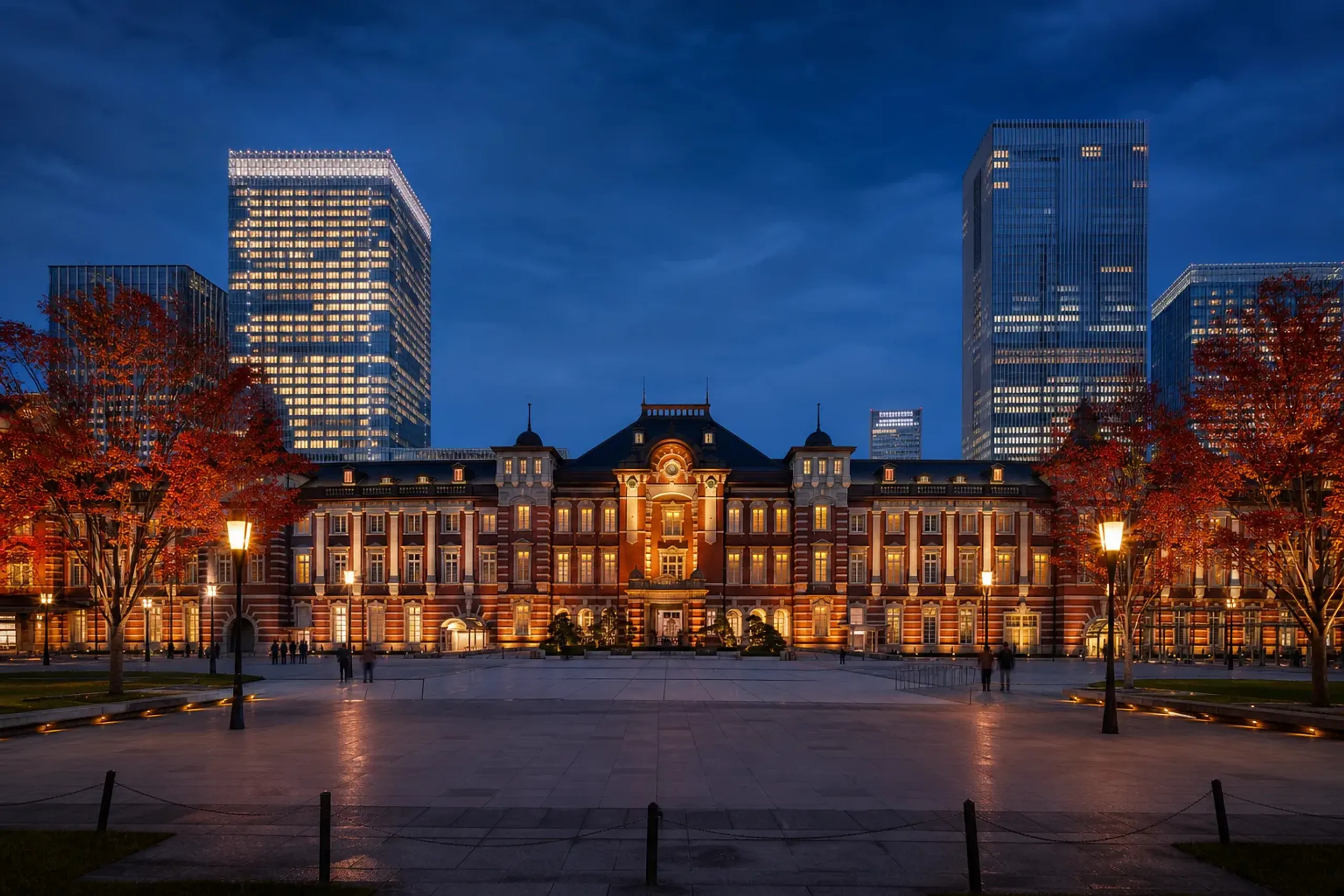 Tokyo Station Marunouchi building at dusk with softly lit architecture and minimal crowds