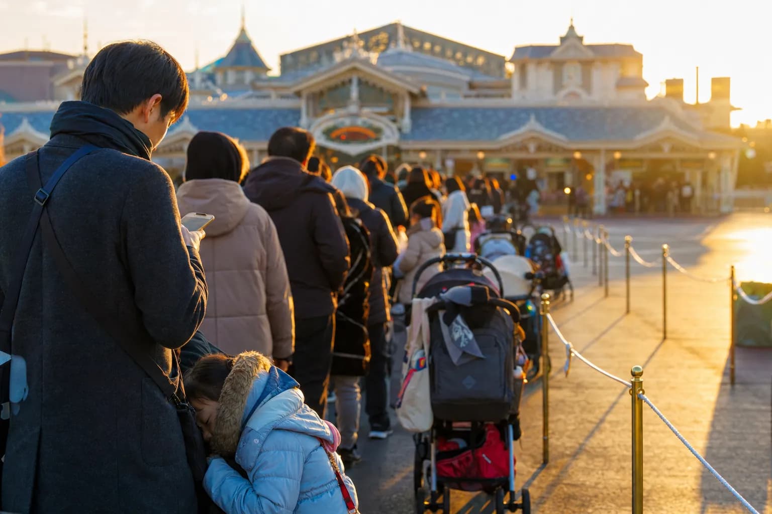 Families arriving early at Tokyo Disneyland entrance in the morning at Maihama