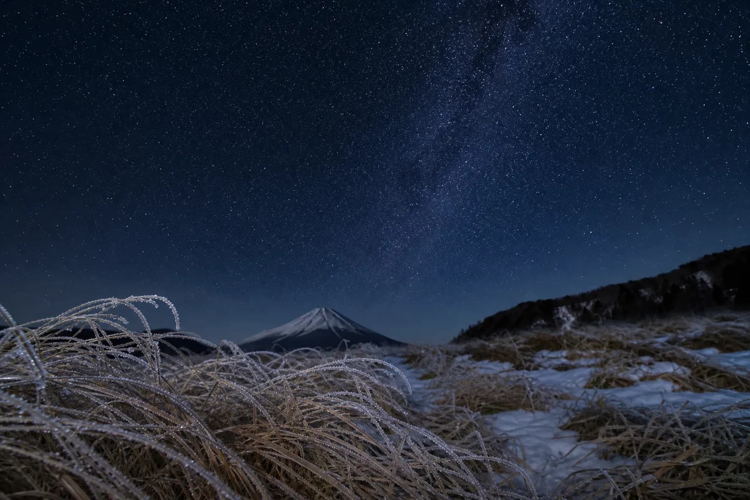 Frosted alpine foreground under a clear starry sky in central Hokkaido