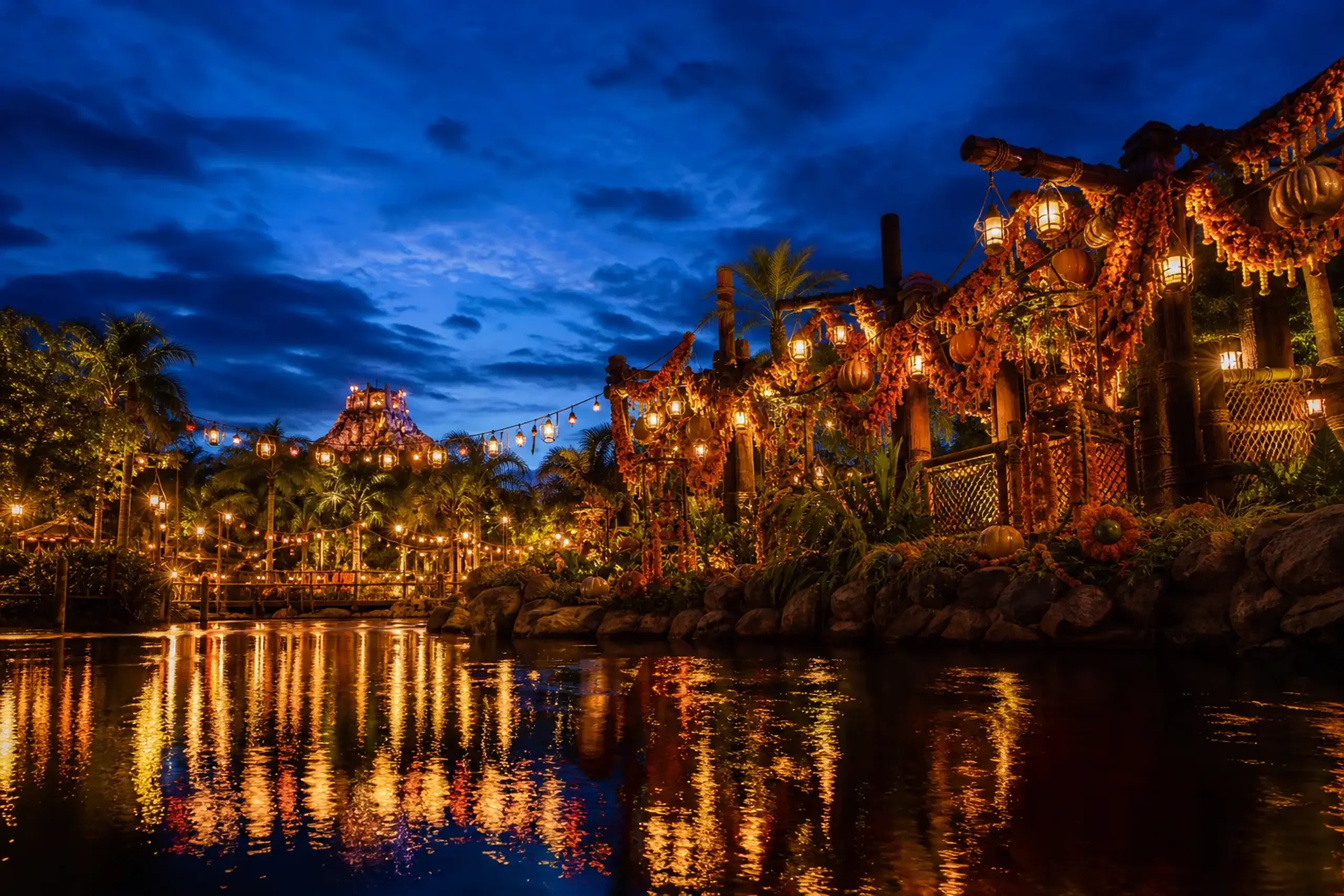 Marigold-decorated jungle river area at Tokyo DisneySea at dusk during the autumn Dia de Muertos programme