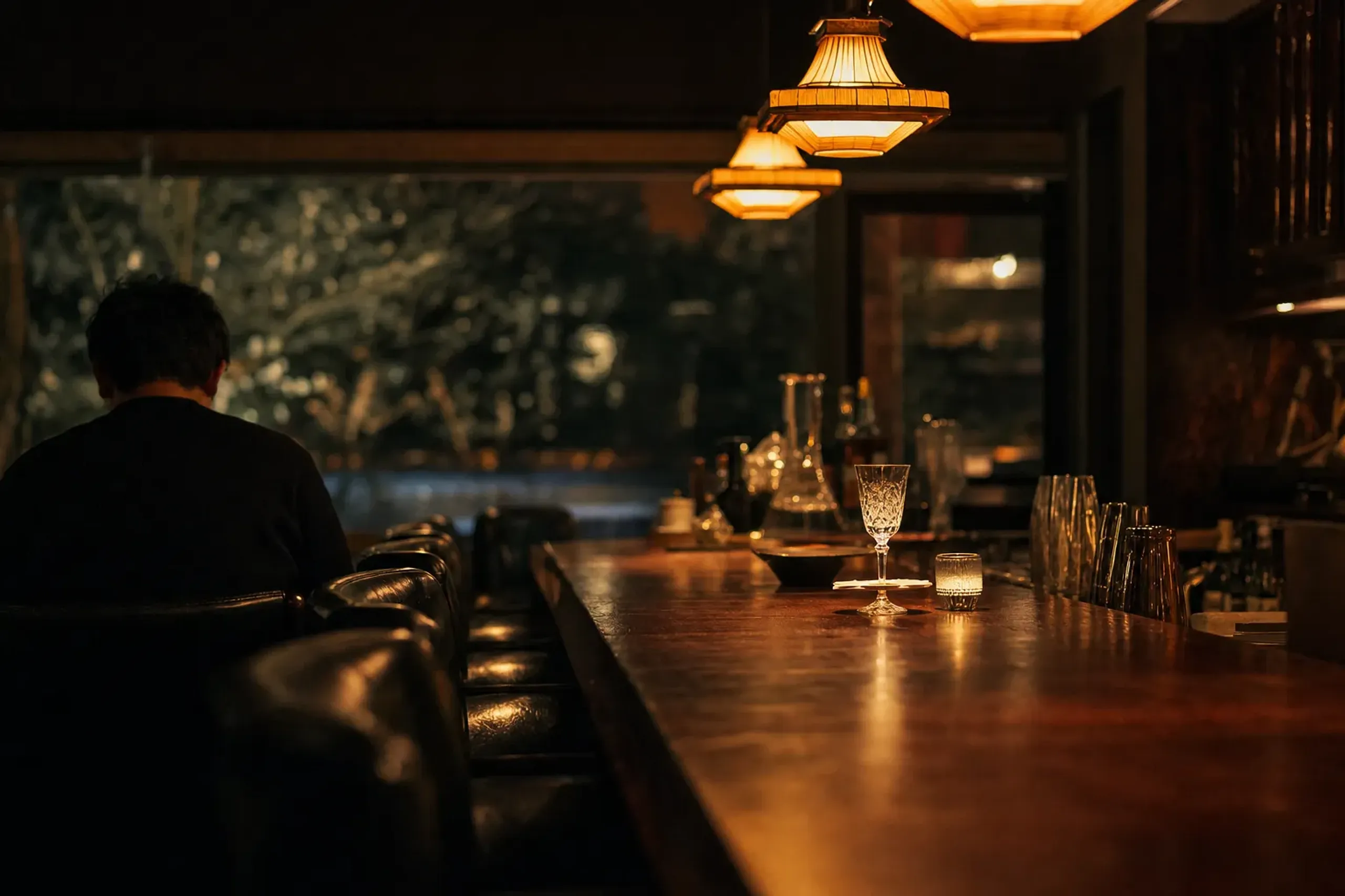 The six-seat Shinmonzen Bar designed by Stephanie Goto, with its retro edges and Manhattan-inflected lighting over an intimate counter