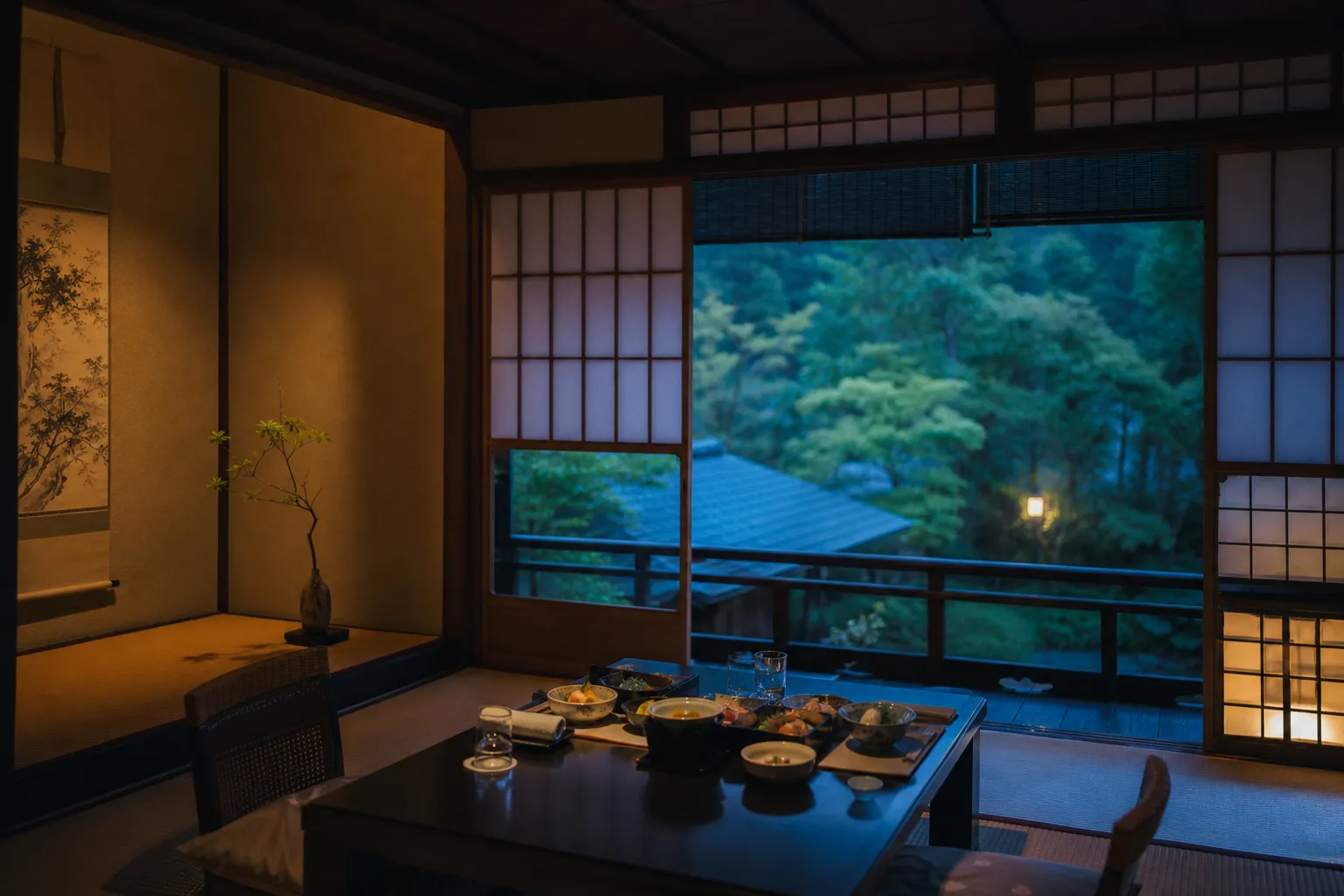 Tatami ryokan room in Kyoto with kaiseki dinner setting and tokonoma alcove