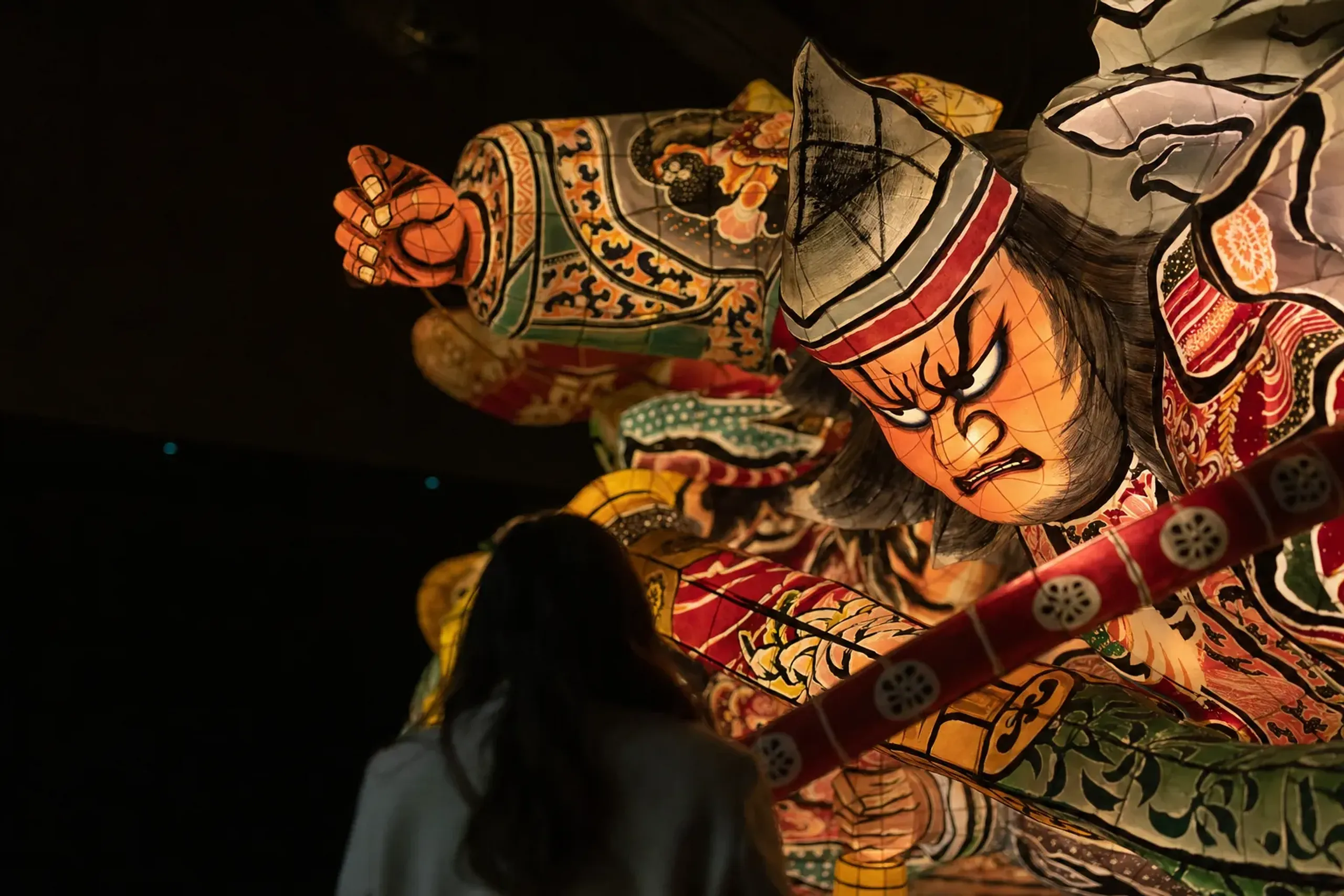 The quiet museum-lit float construction display inside Nebuta House Wa Rasse in Aomori