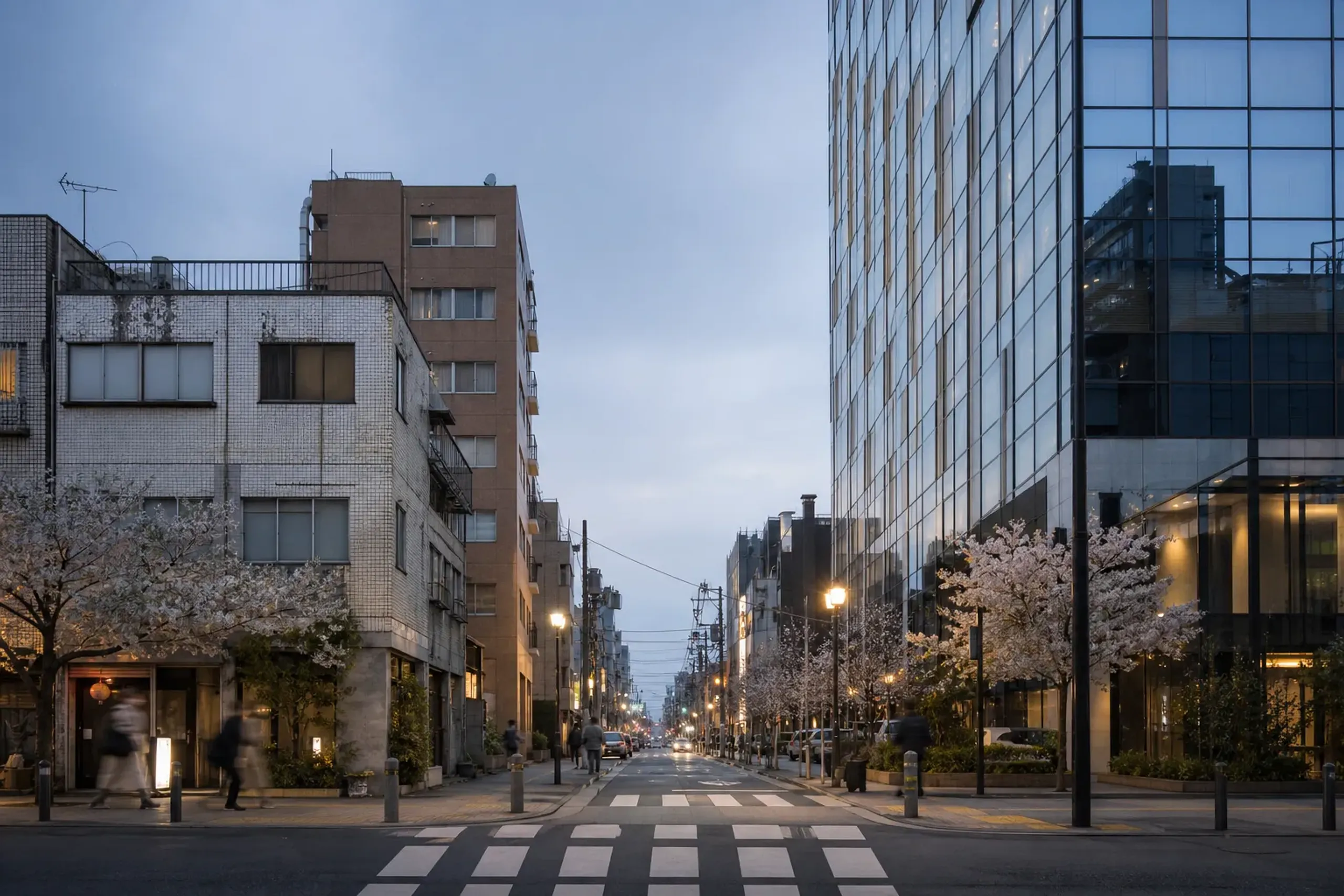 A Tokyo street block showing buildings from different eras side by side, illustrating the city’s pattern of replacement
