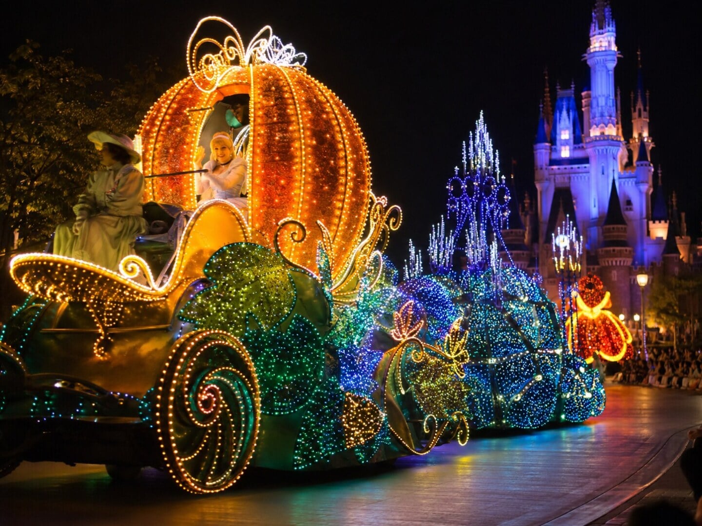 Colourful floats during a Tokyo Disneyland nighttime parade.