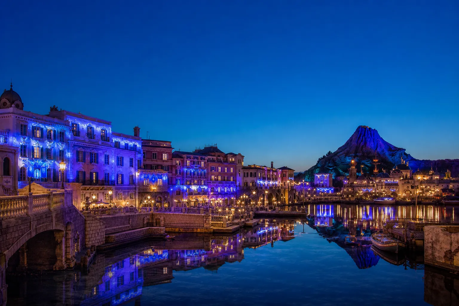 Tokyo DisneySea Mediterranean Harbor at dusk with blue-toned anniversary lighting during Sparkling Jubilee