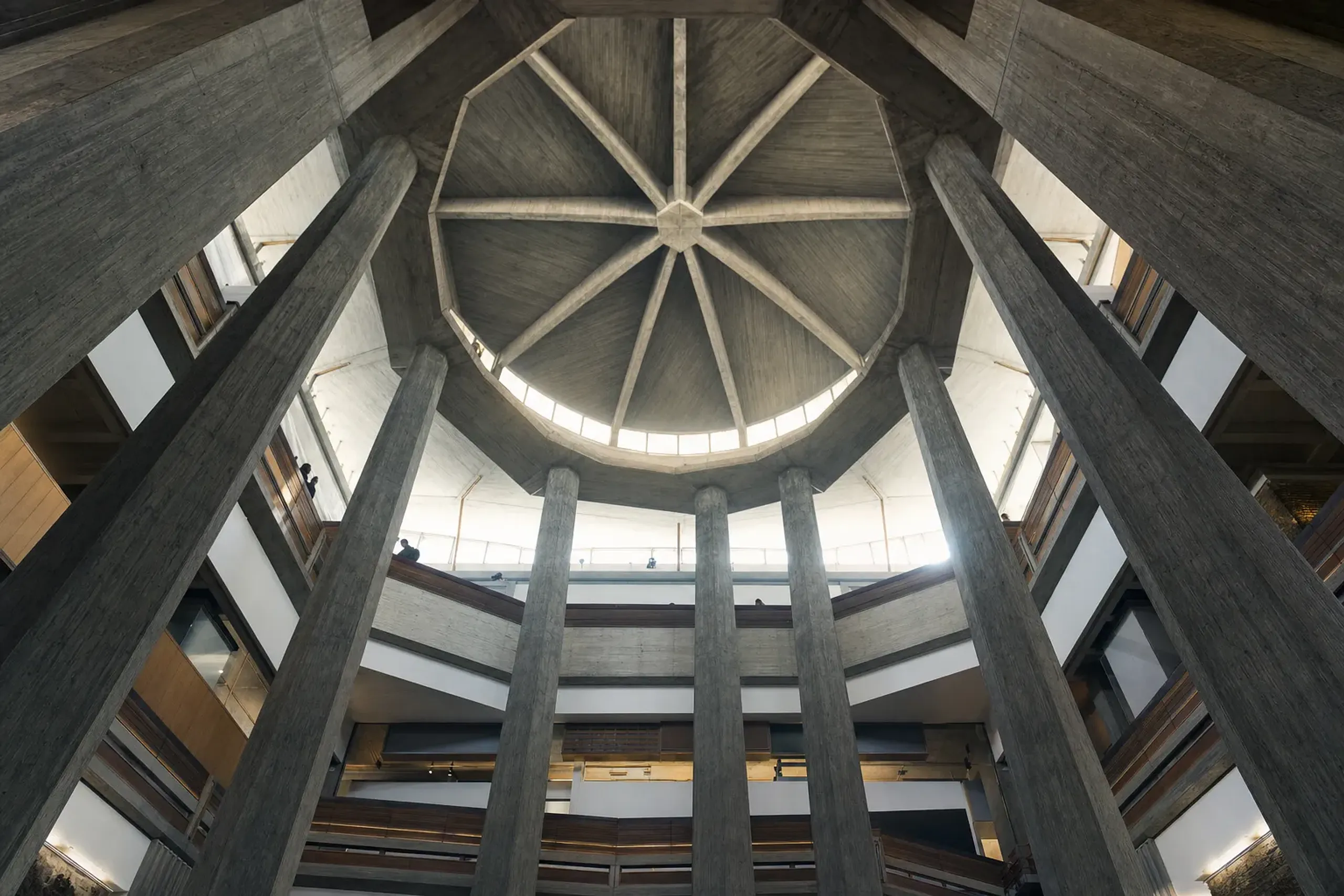 The soaring central hall of the National Museum of Western Art's Main Building, looking up toward the modernist ceiling and clerestory light of Le Corbusier's interior