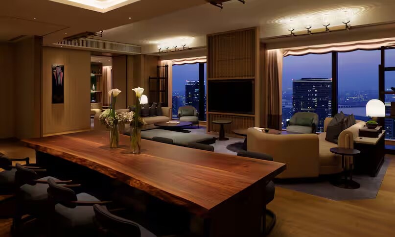 The private dining area inside the Waldorf Astoria Osaka Presidential Suite is set for a formal dinner.