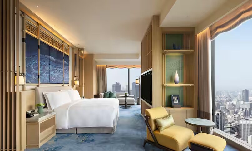 The serene and spacious main bedroom in the Waldorf Astoria Osaka Presidential Suite.