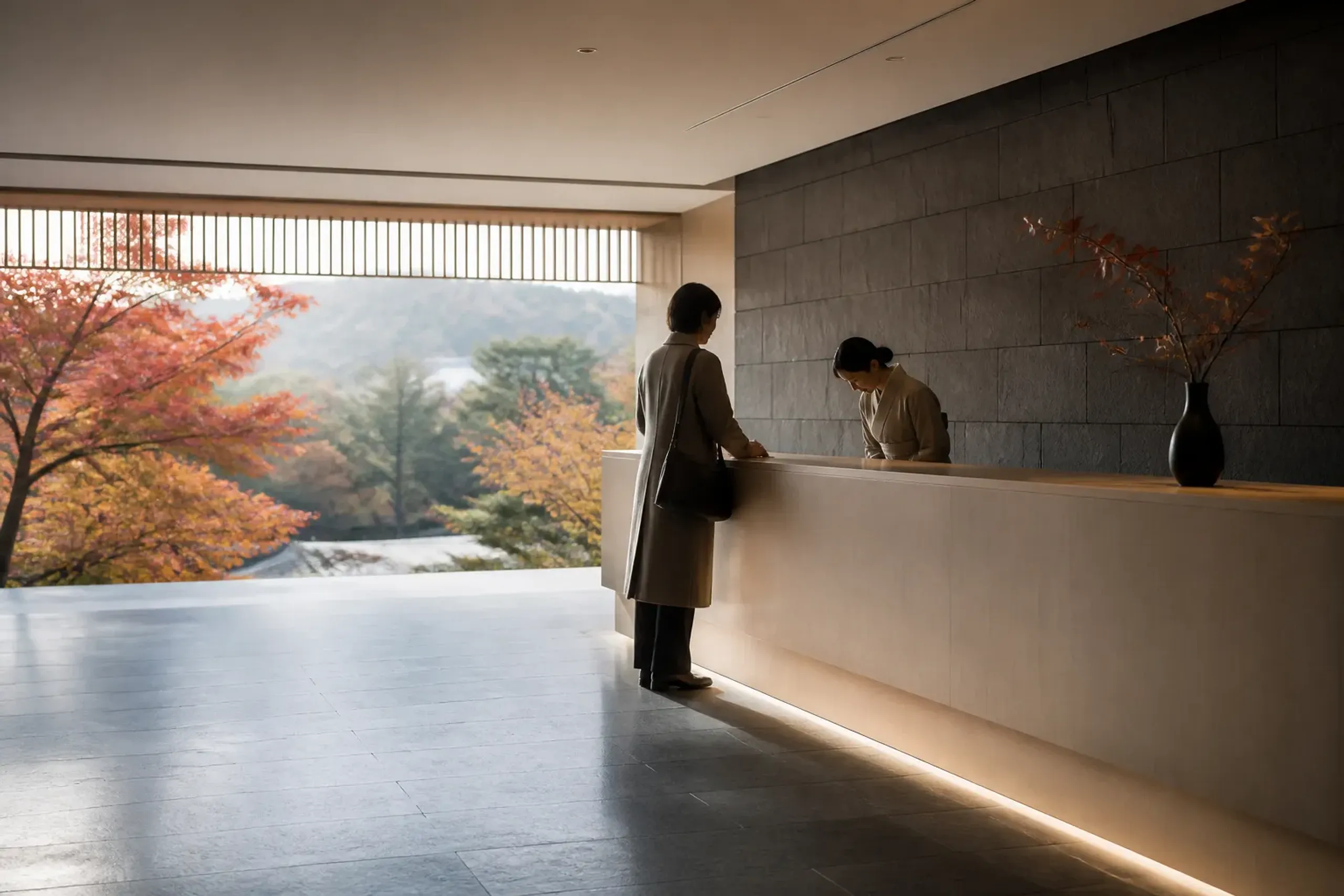 Guest checking into a Japanese hotel lobby carrying only a small bag
