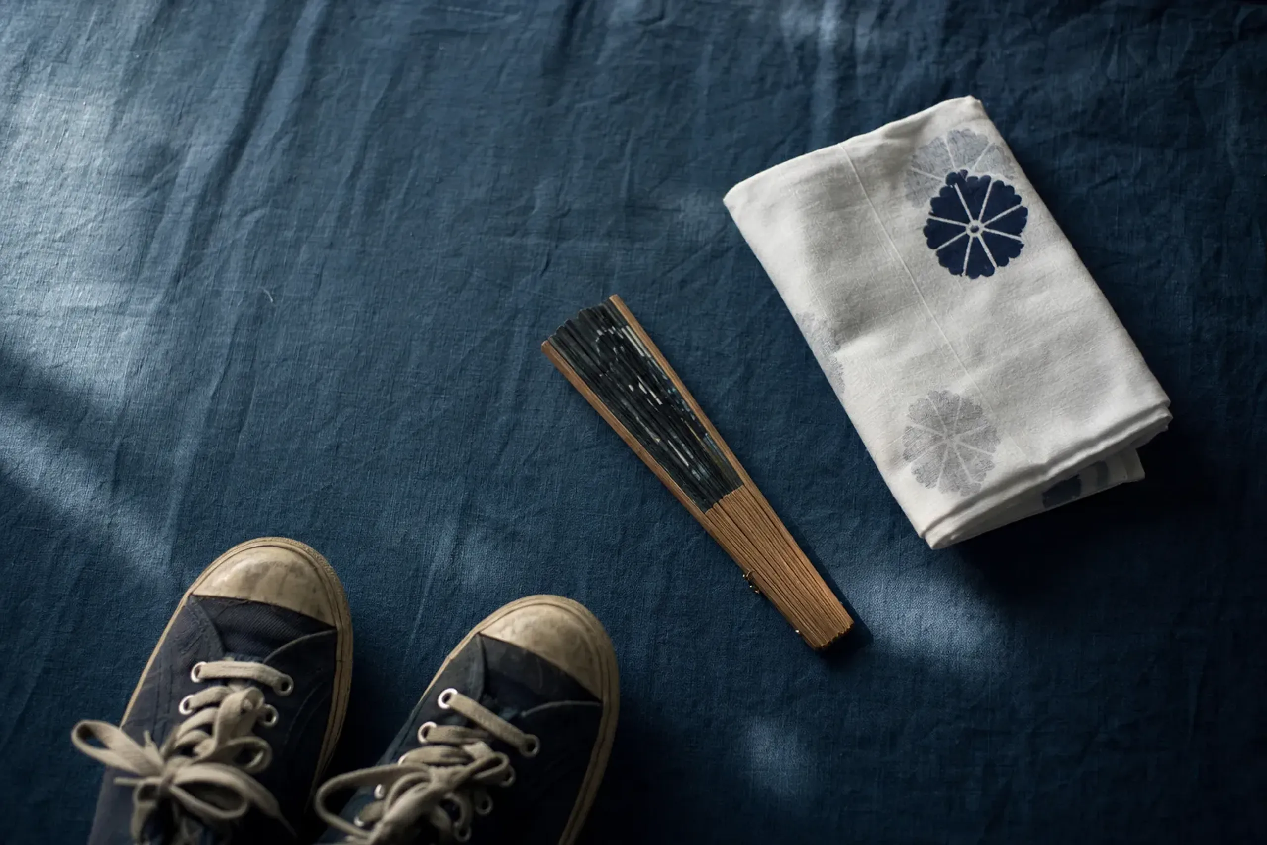 A hand towel, a compact fan, and shoes you can