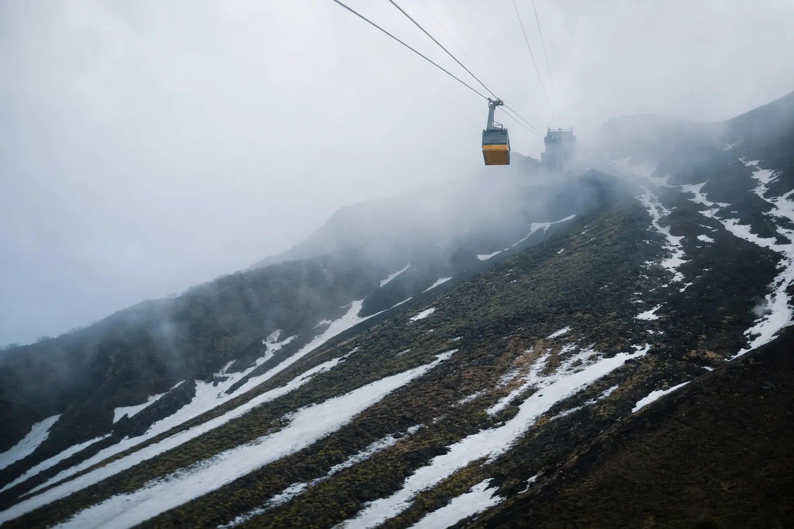 The Zaō Ropeway cabin ascending from the town toward the Jizō-sanchō Summit Station at 1,661 metres