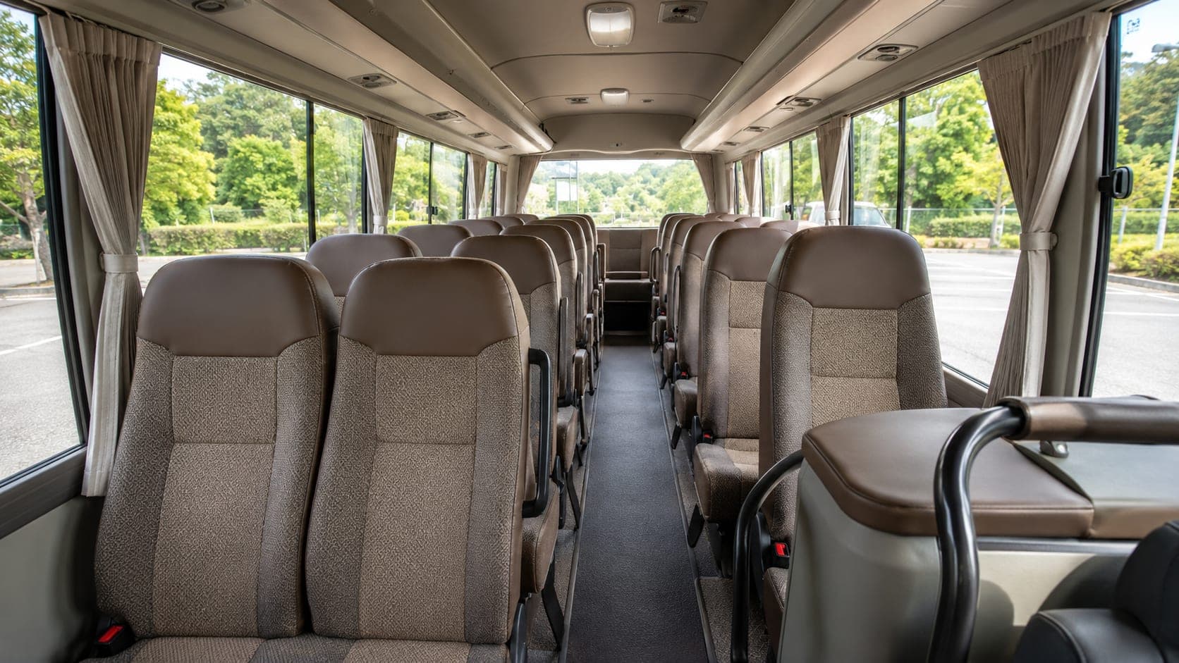 Interior view of the Toyota Coaster minibus aisle and rows
