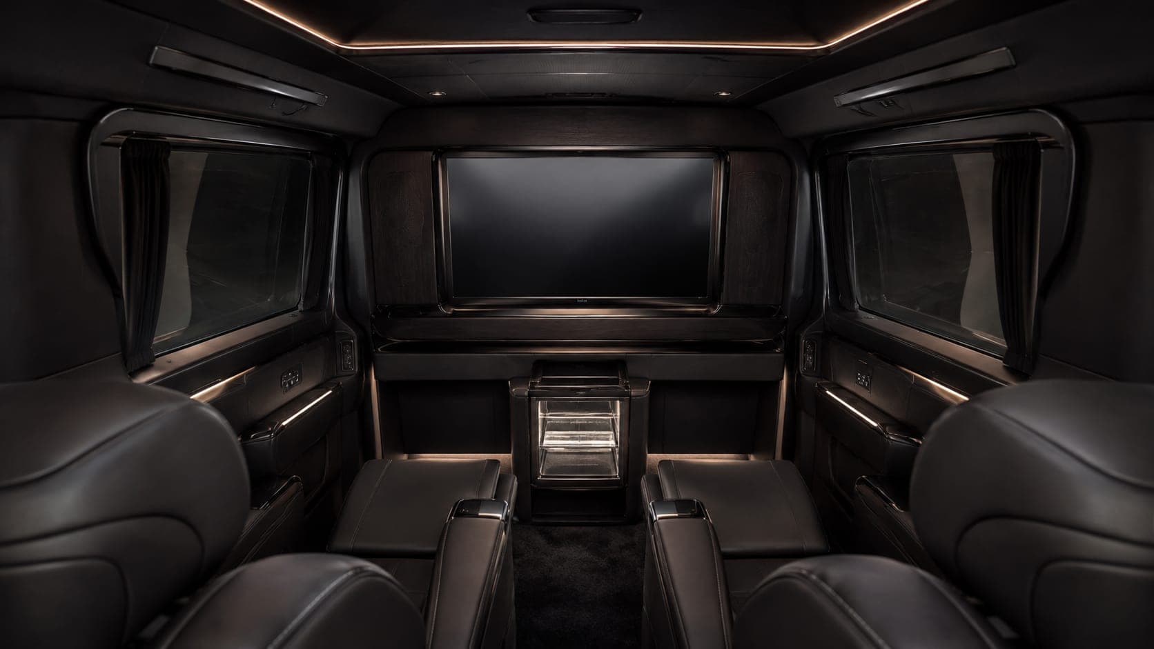 Interior view of the Lexus LM500h rear lounge with partition screen