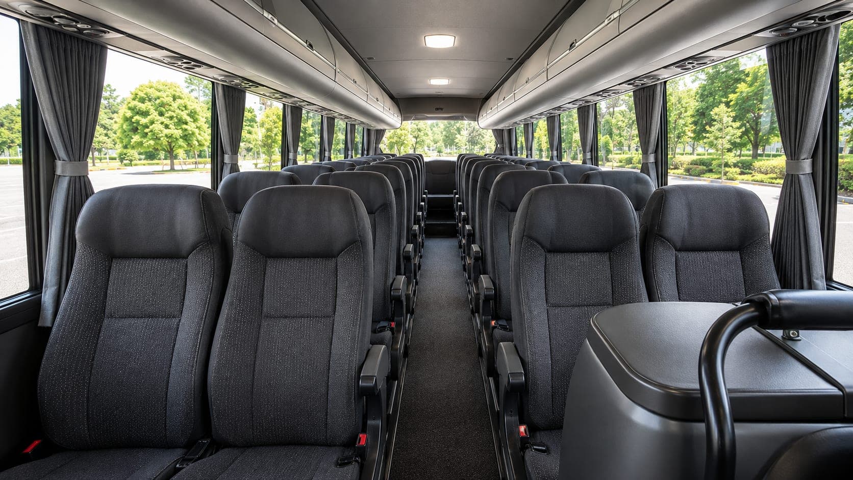 Interior view of the mid-size coach reclining rows and overhead racks