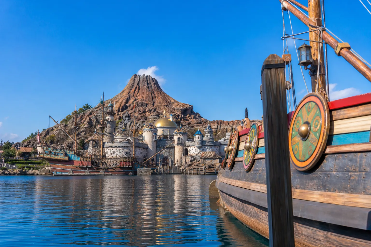 Tokyo DisneySea themed harbor with Mediterranean architecture at golden hour