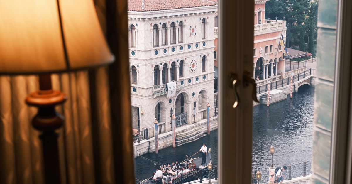 Venetian Gondolas ride at Tokyo DisneySea with a gondola on the canal and Mediterranean-style buildings