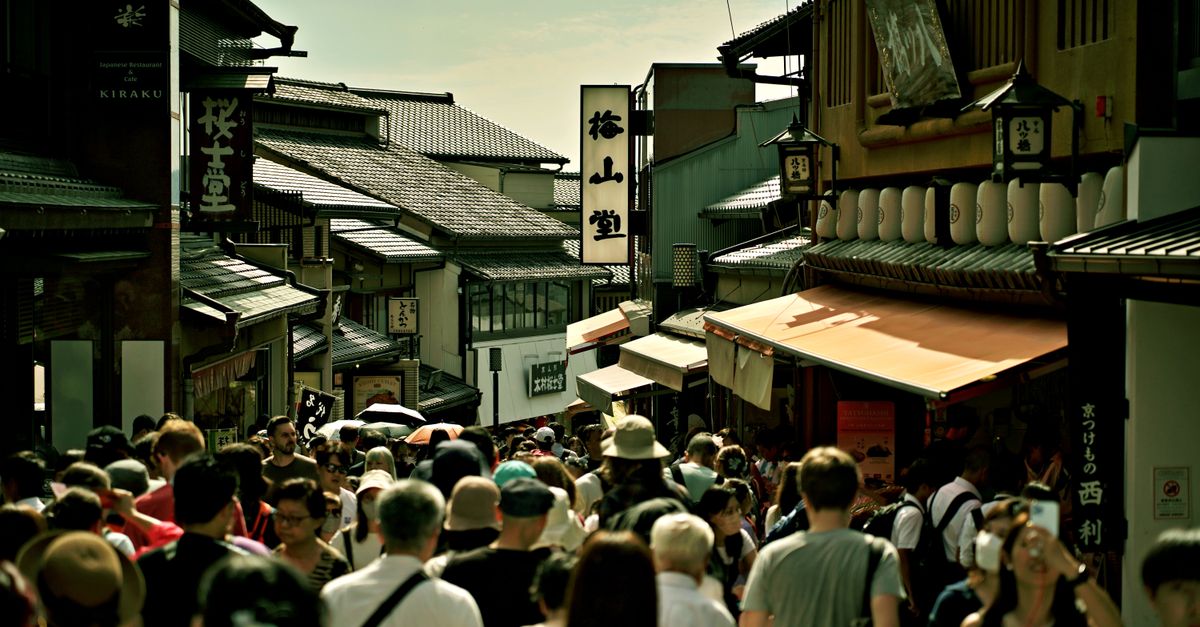 Quiet Kyoto lane in Gion at sunrise with traditional wooden buildings